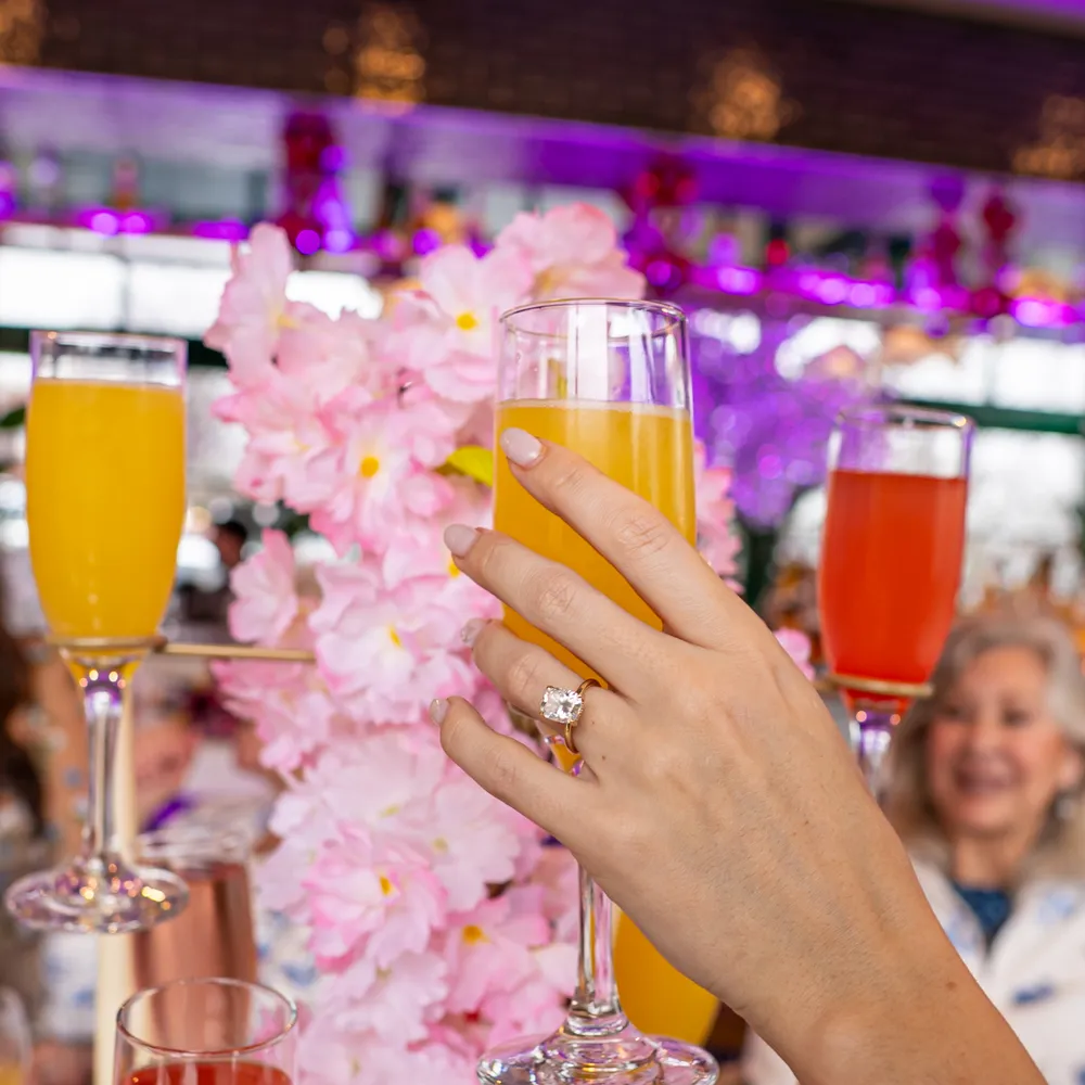 Bottomless mimosas toast at Bloom Room