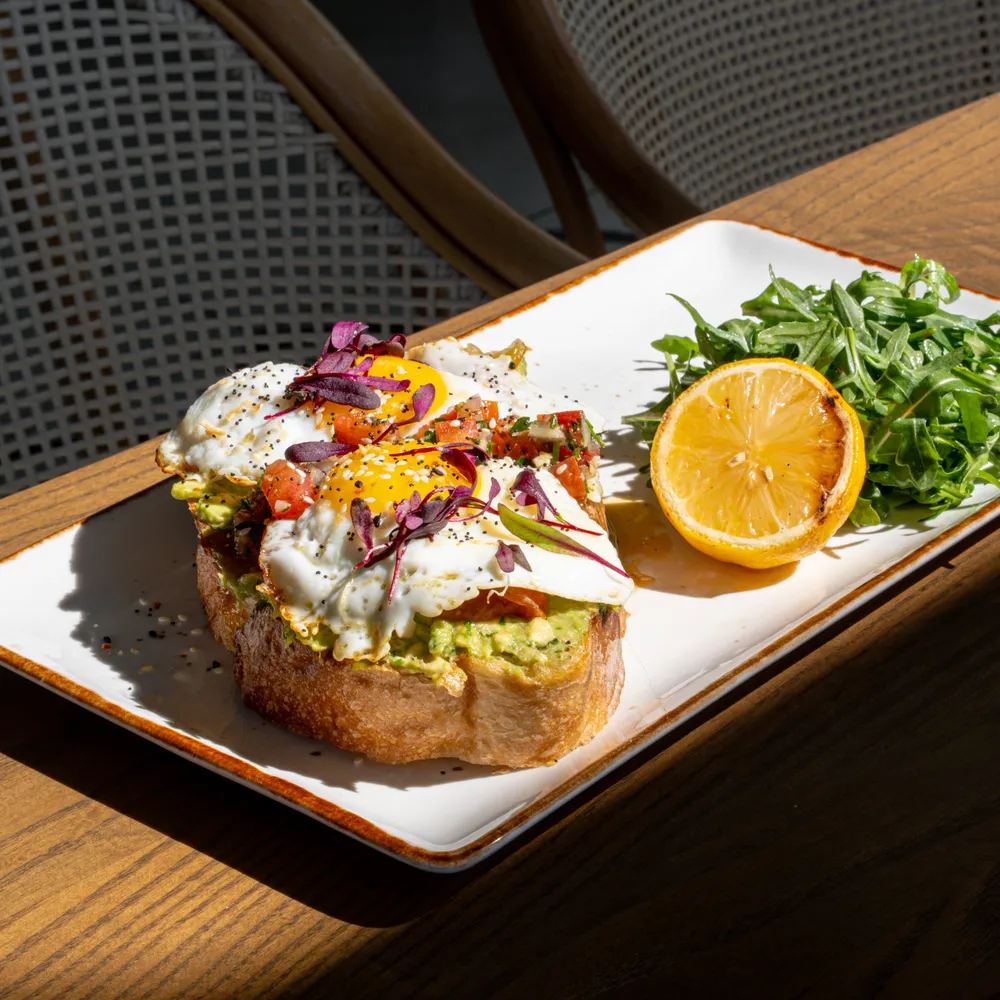 Hipster avocado toast with eggs at Bloom Room
