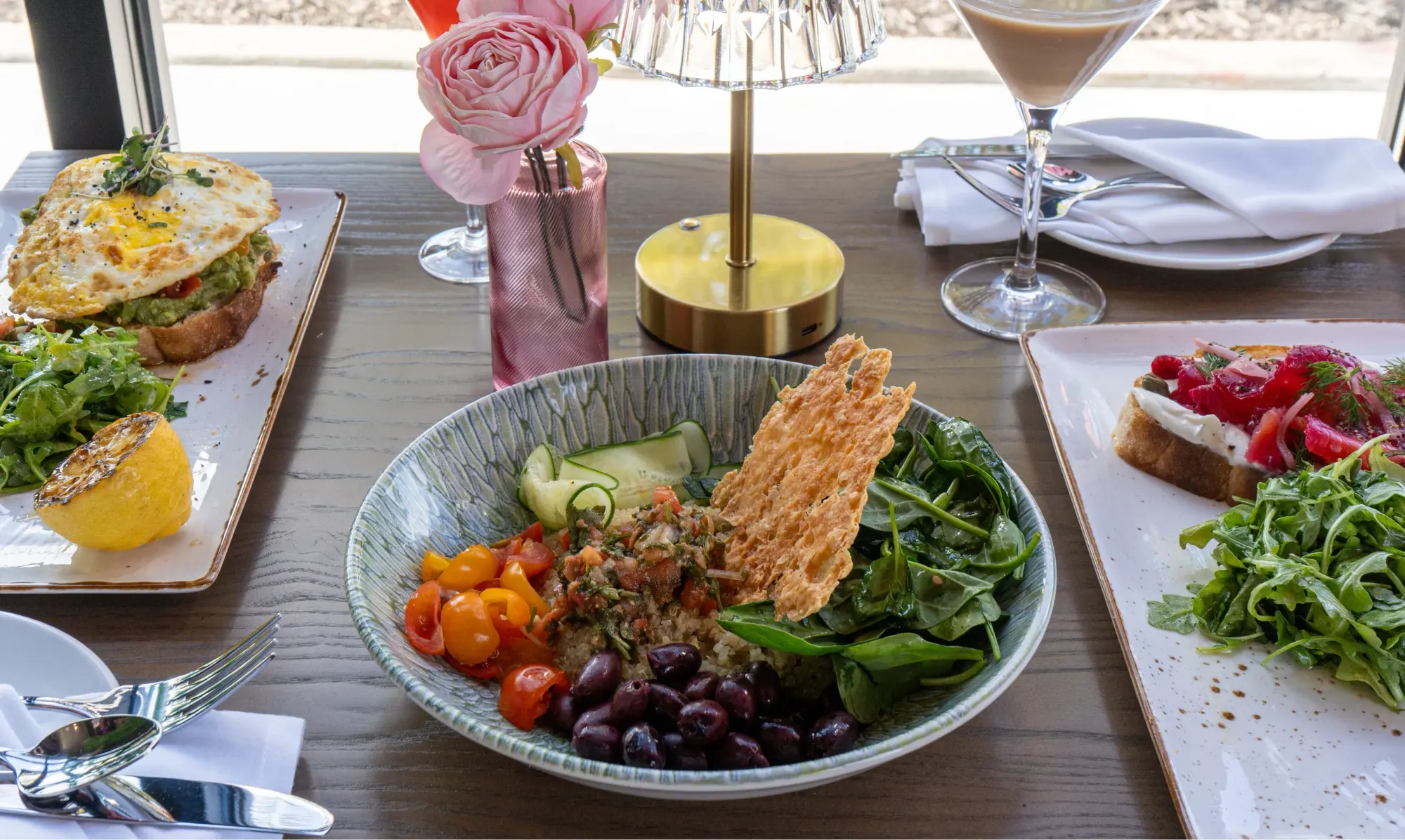 Inside Bloom Room — bright, plant-filled dining space